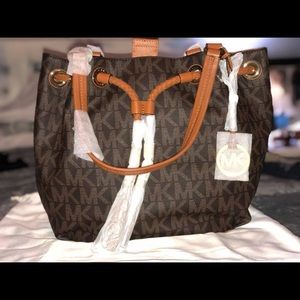 Never used MC hand bag.